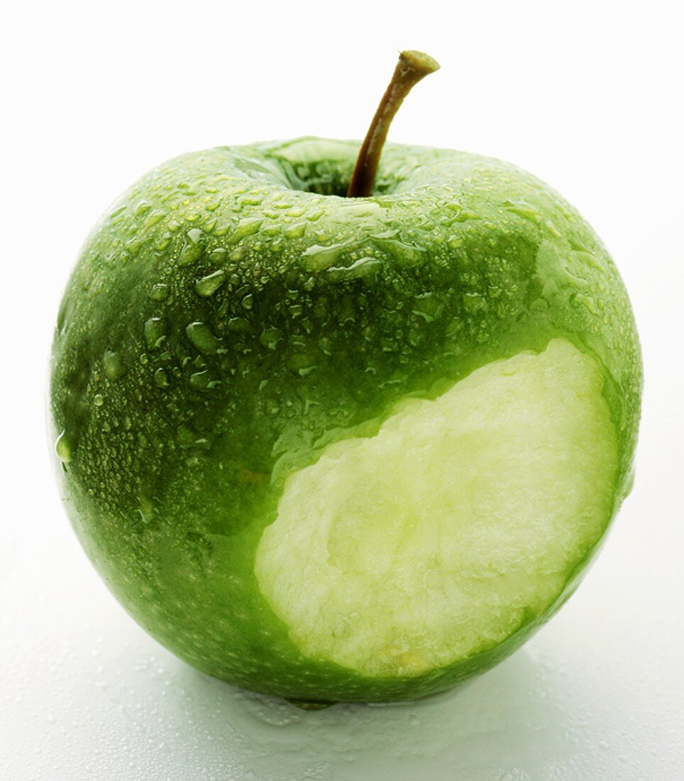 A Bitten Granny Smith Apple