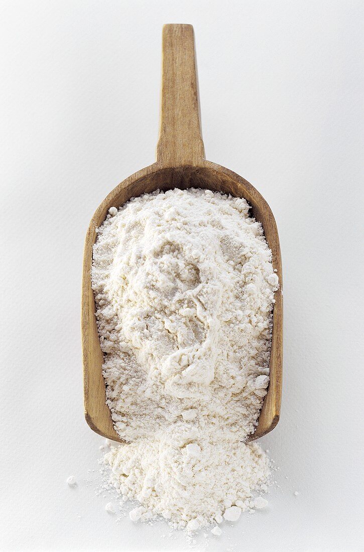 A Wooden Scoop Filled with Flour