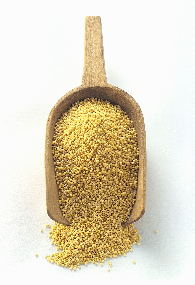 Millet in a Wooden Scoop