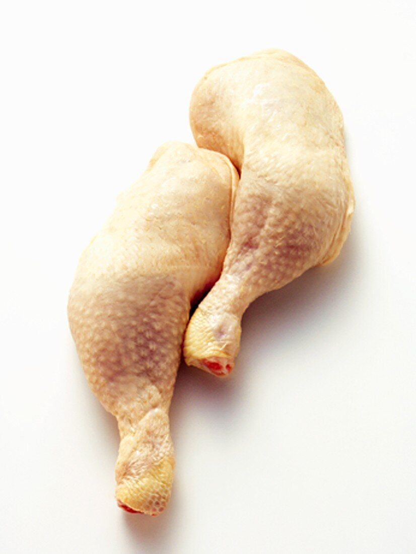 Two Uncooked Chicken Legs
