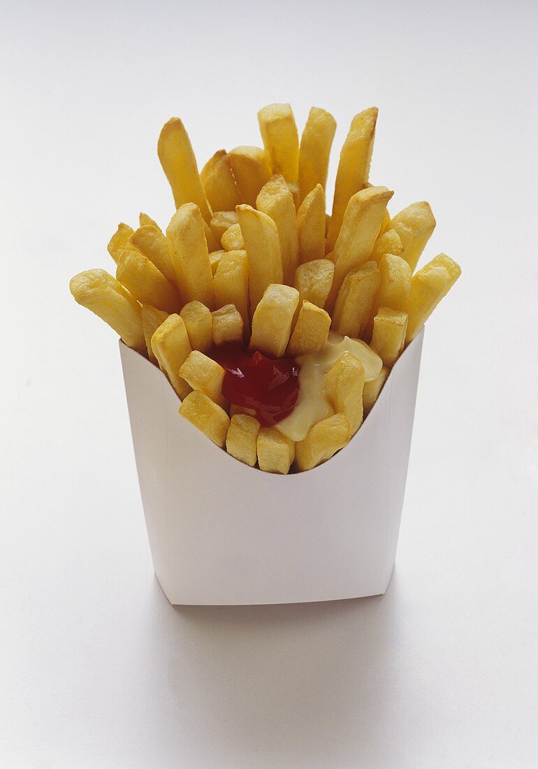 French Fries in White Fast Food Box with Mayonnaise and Ketchup