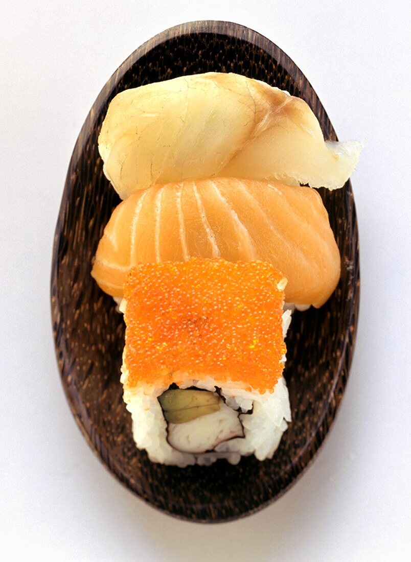Assorted sushi in wooden bowl