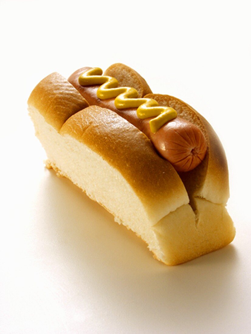 A Hot Dog in a Bun with Mustard