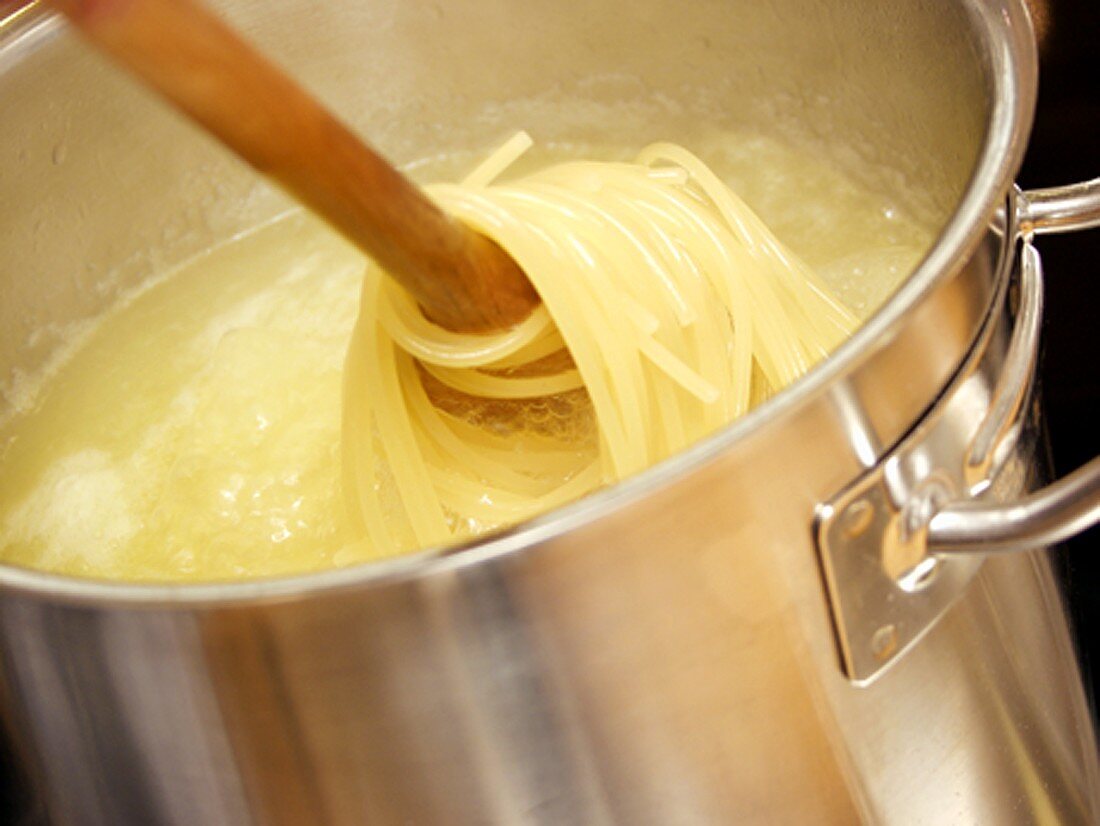 Spaghetti Being Stired in Pot