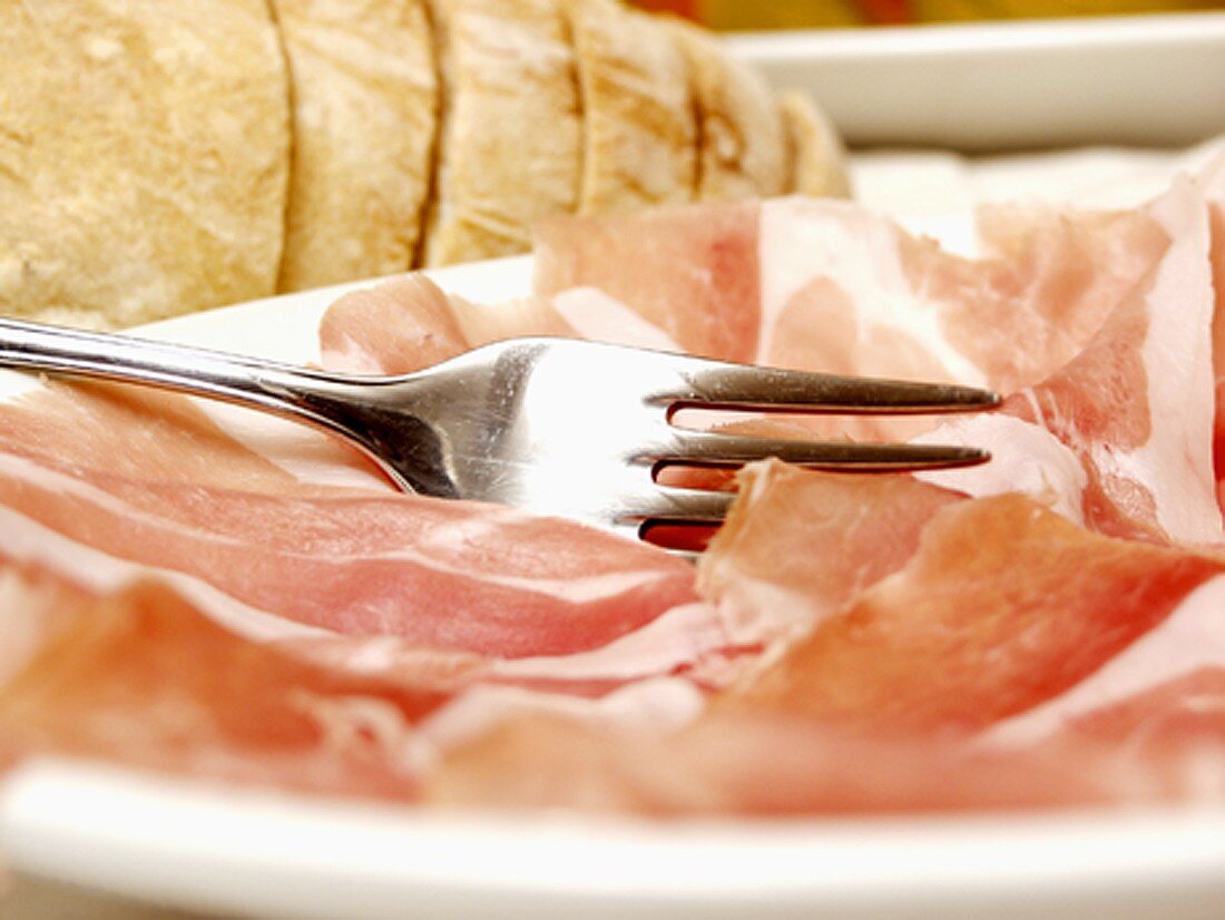 Sliced Procuitto on Plate with Fork