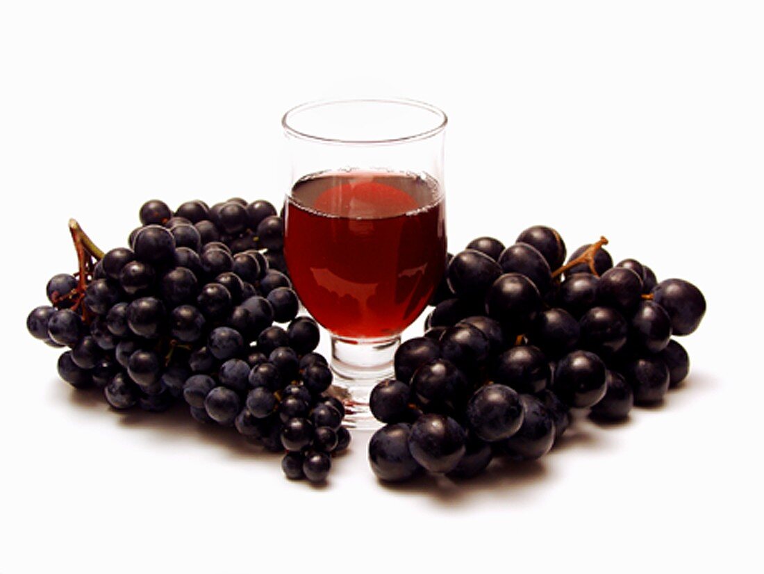 Purple Grapes with a Glass of Red Wine