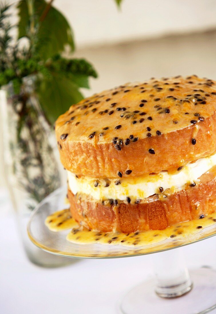 Sponge cake with cream and passion fruit sauce