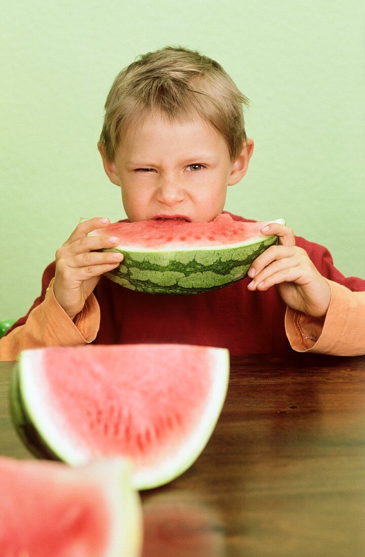 Boy eating watermelon