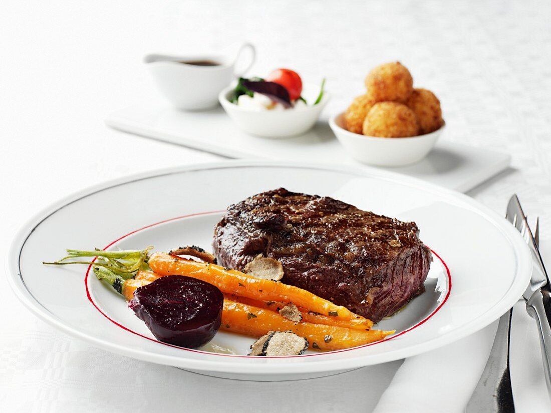 Beef steak with carrots and beetroot