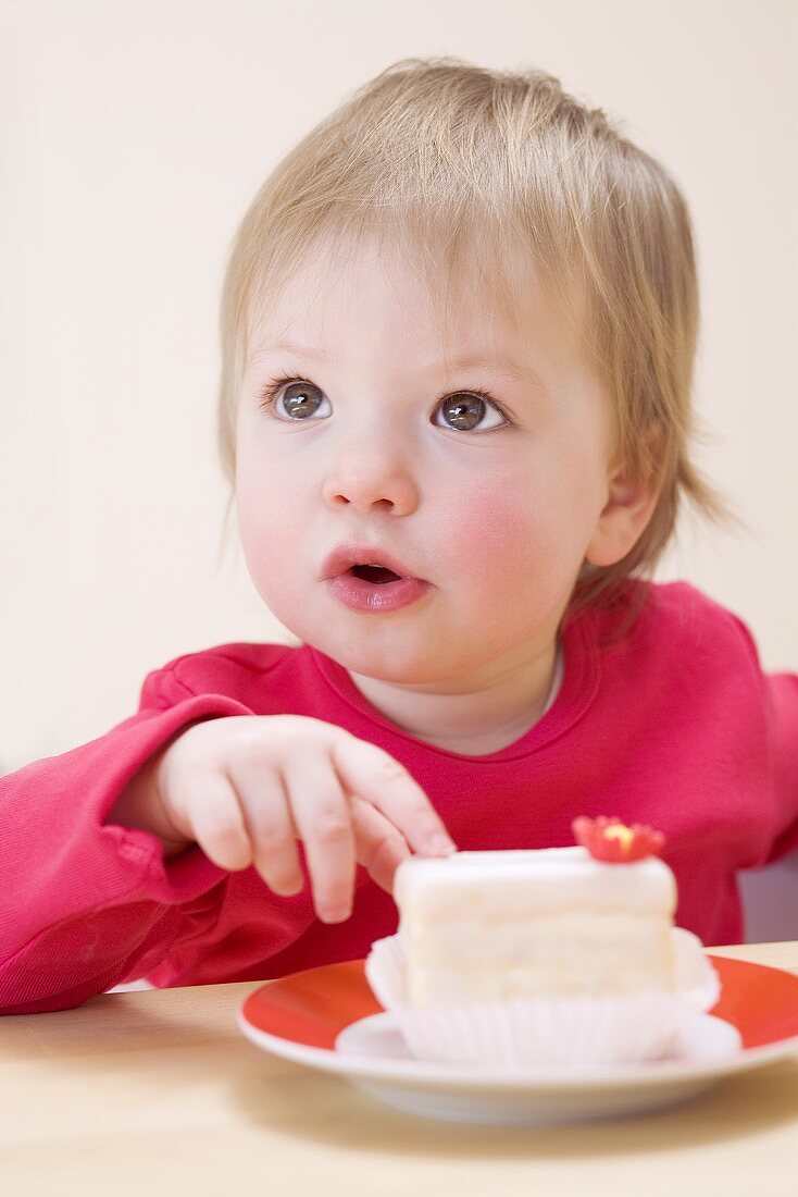 Small girl with a white cake