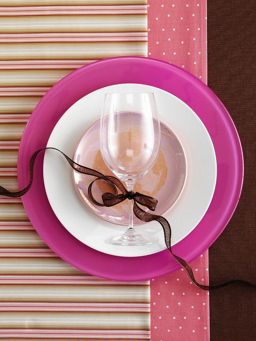 Pink place-setting with wine glass