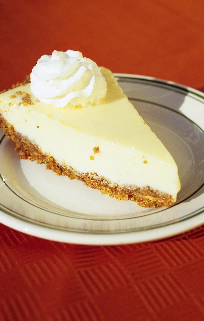 A piece of Key lime pie with whipped cream (USA)