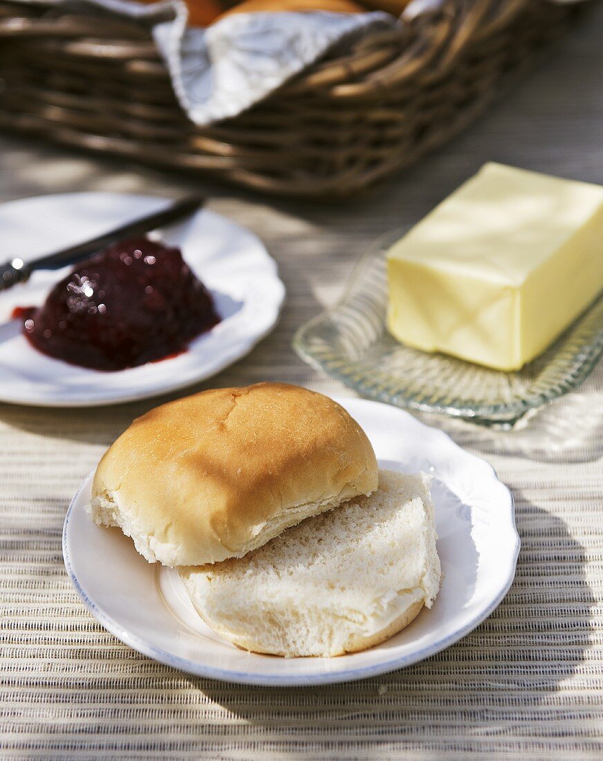Bread roll with butter and jam