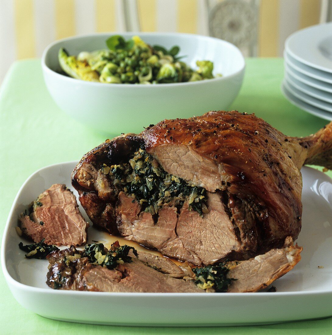 Roast leg of lamb with spinach gremolata stuffing
