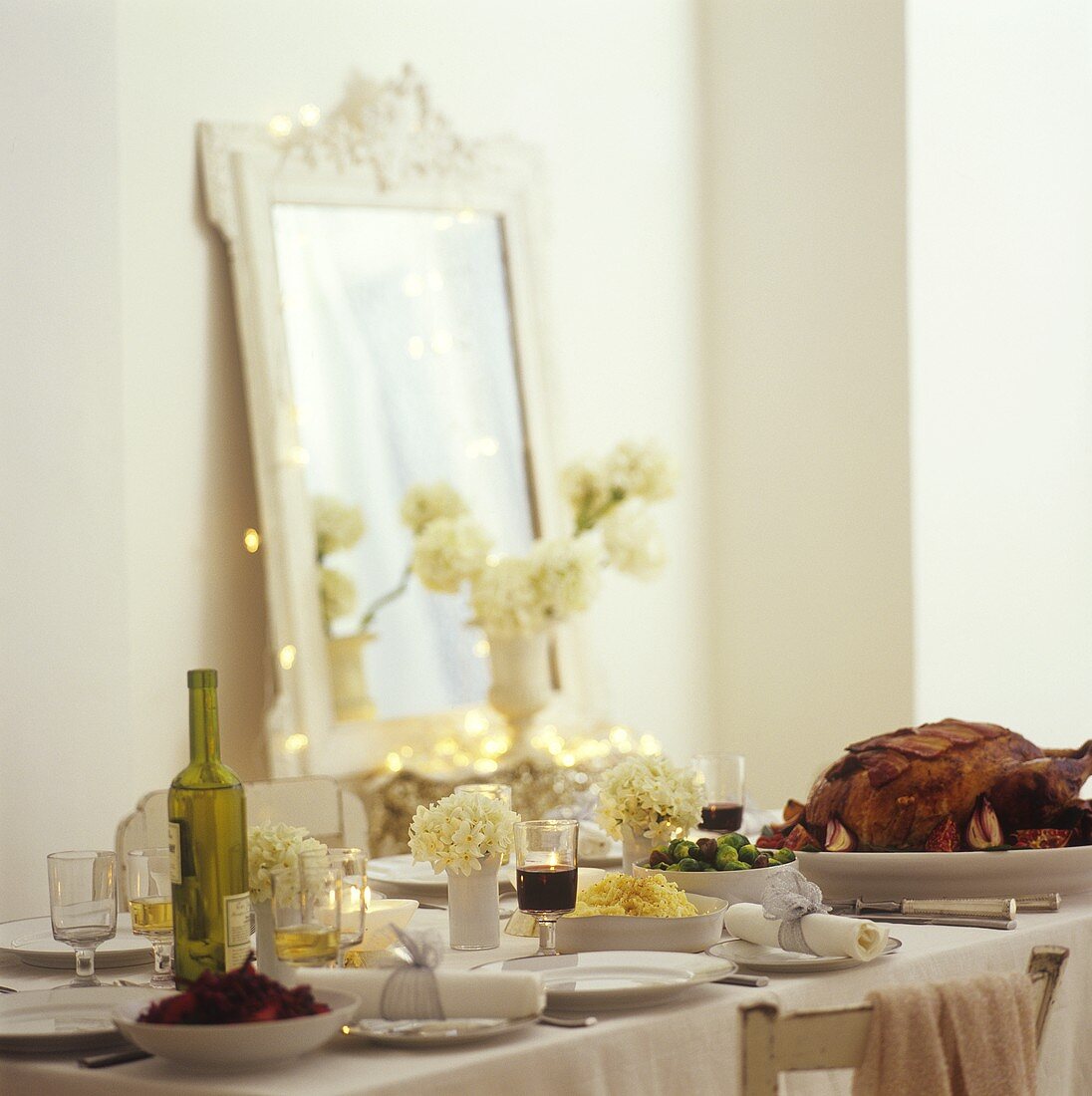 Roast turkey and accompaniments on laid table