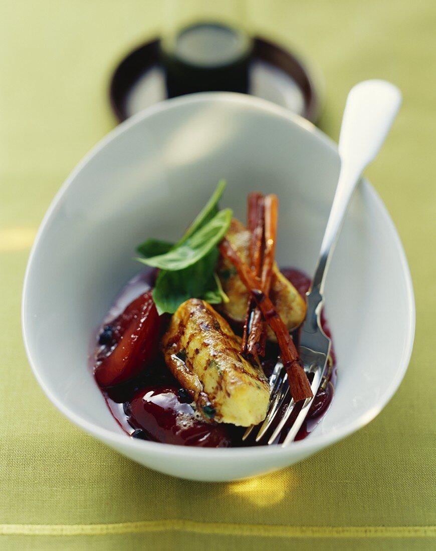 Ricotta dumplings with peppered plums and basil
