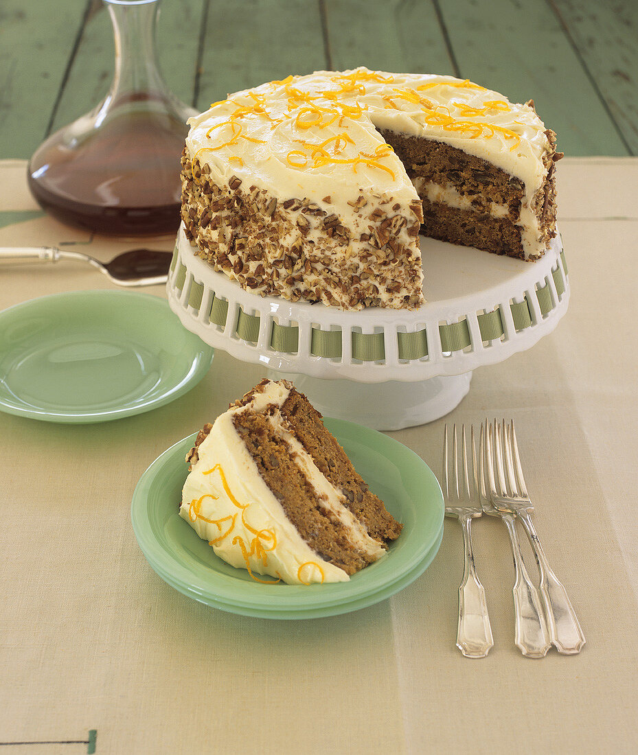 Walnut cake with orange cream, a piece removed