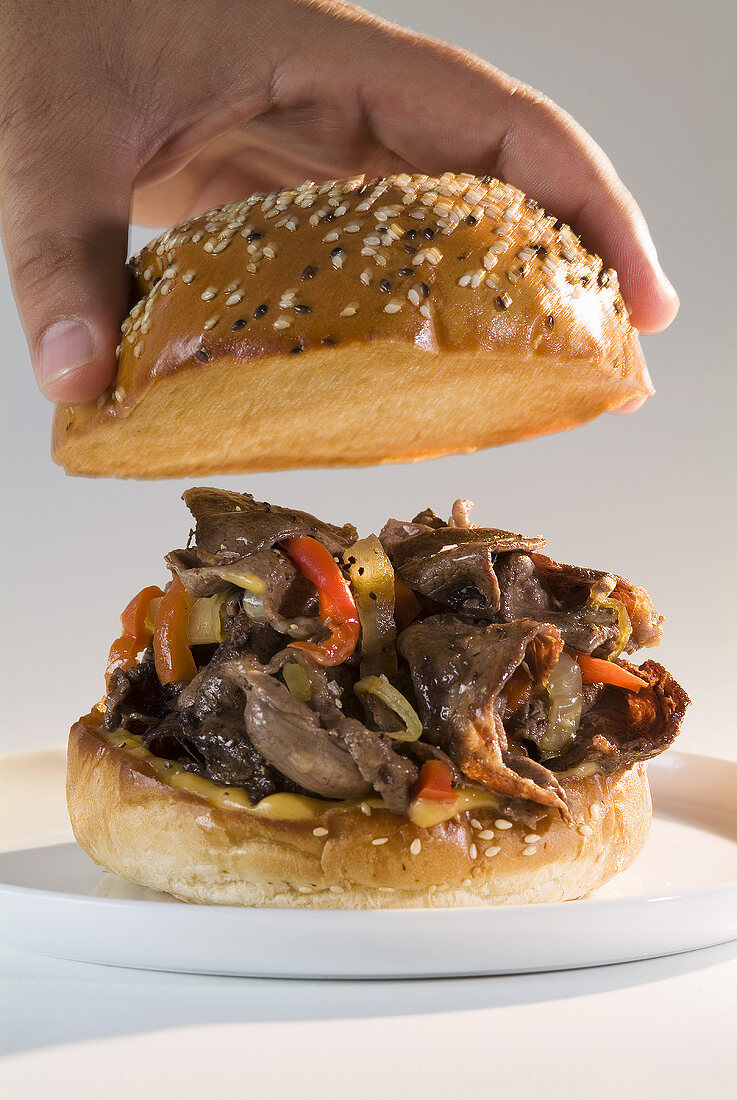 Philly steak sandwich (Beef, peppers & onions in bread roll)