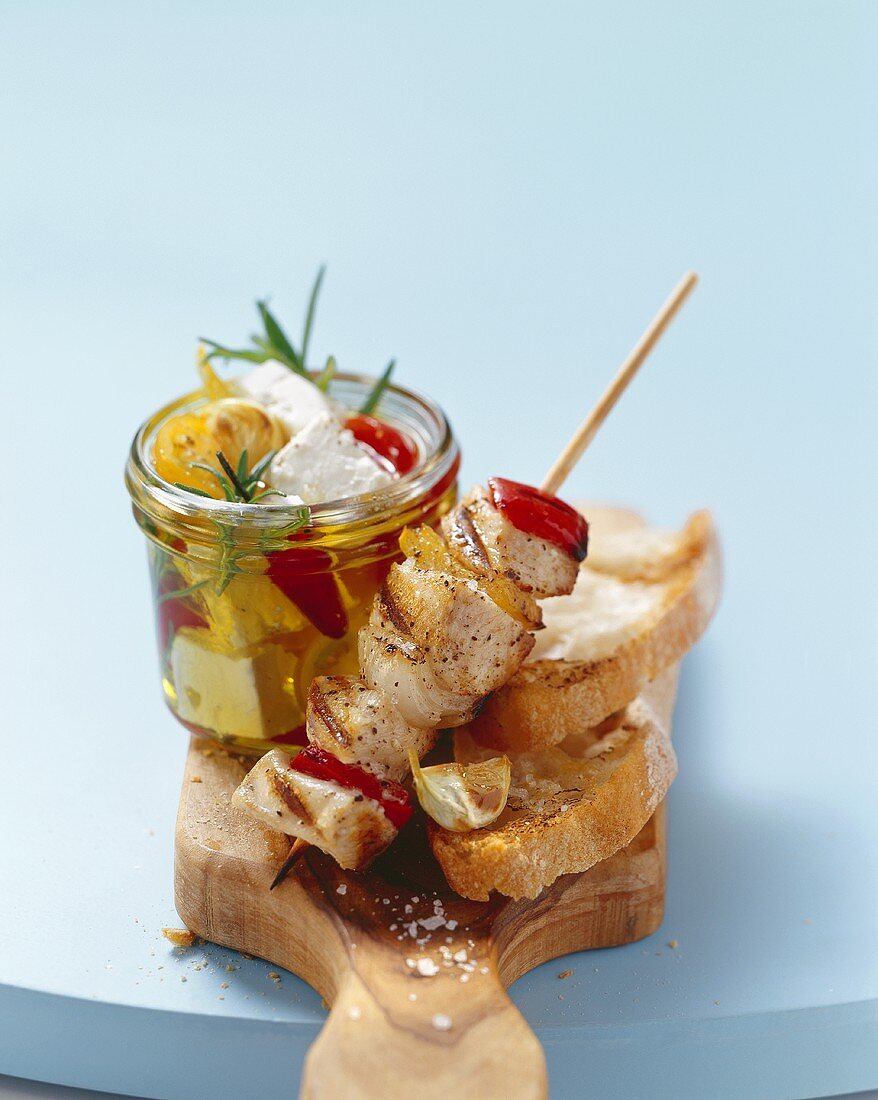 Fish kebab, pickled sheep's cheese and white bread