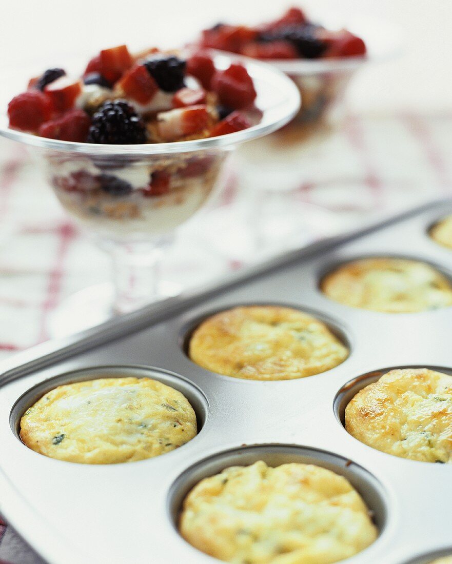 Mini-frittatas and yoghurt muesli with berries for brunch