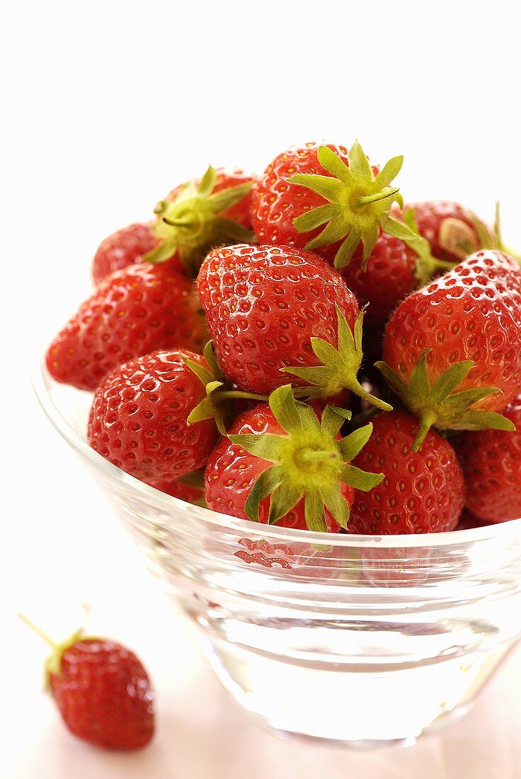 Fresh strawberries in a glass bowl