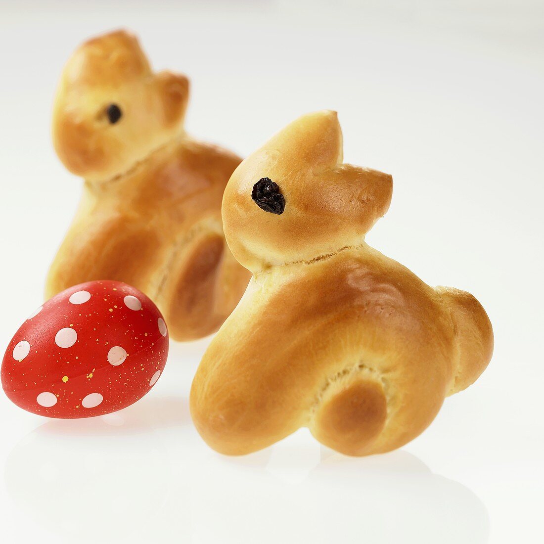 Coloured egg with home-baked Easter Bunnies