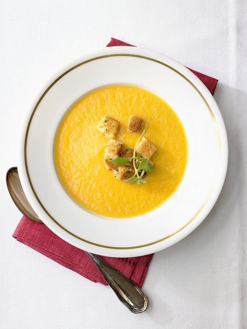 Pumpkin soup with herb and garlic croutons