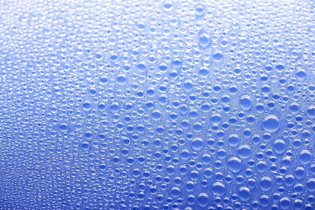 Drops of water on blue background