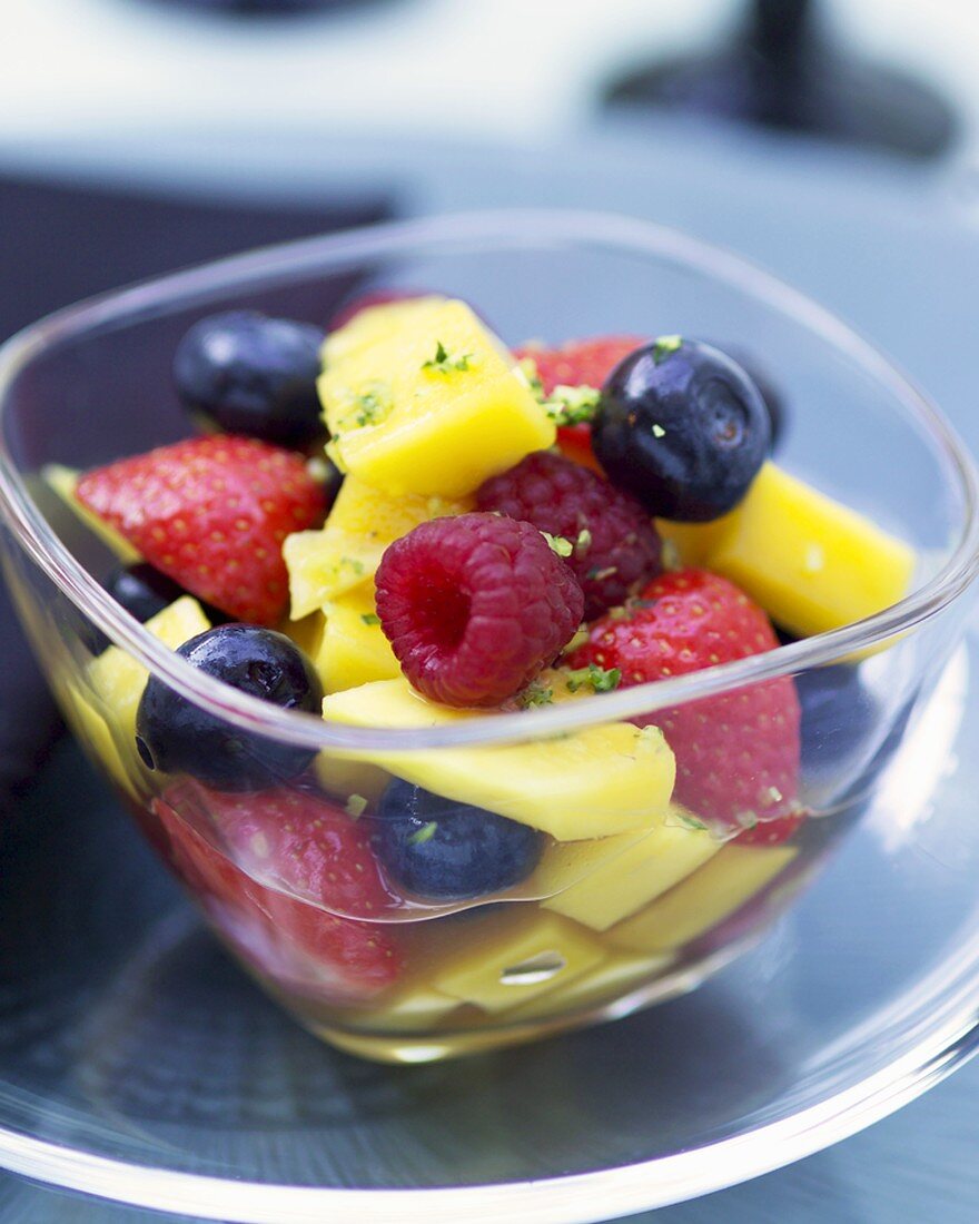 Mango and mixed berry salad with vodka