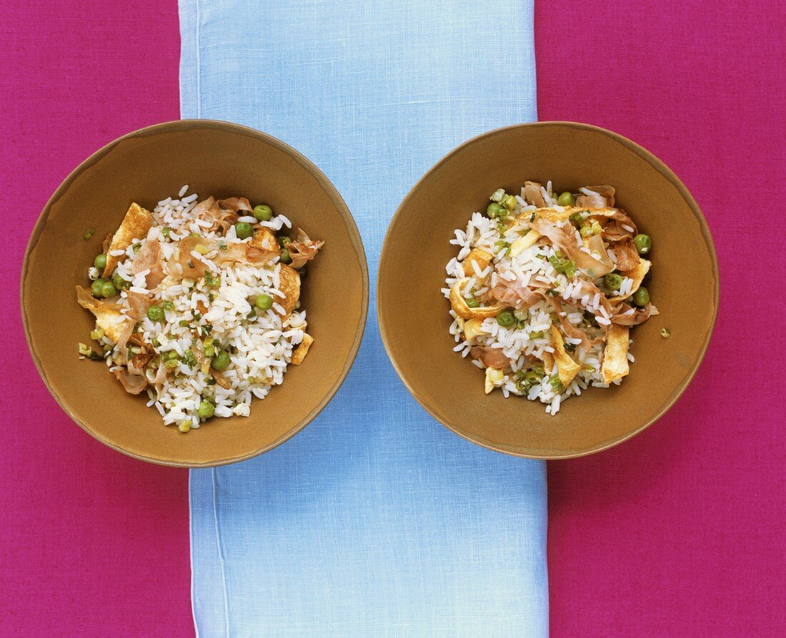 Fried rice with omelette strips, ham and peas