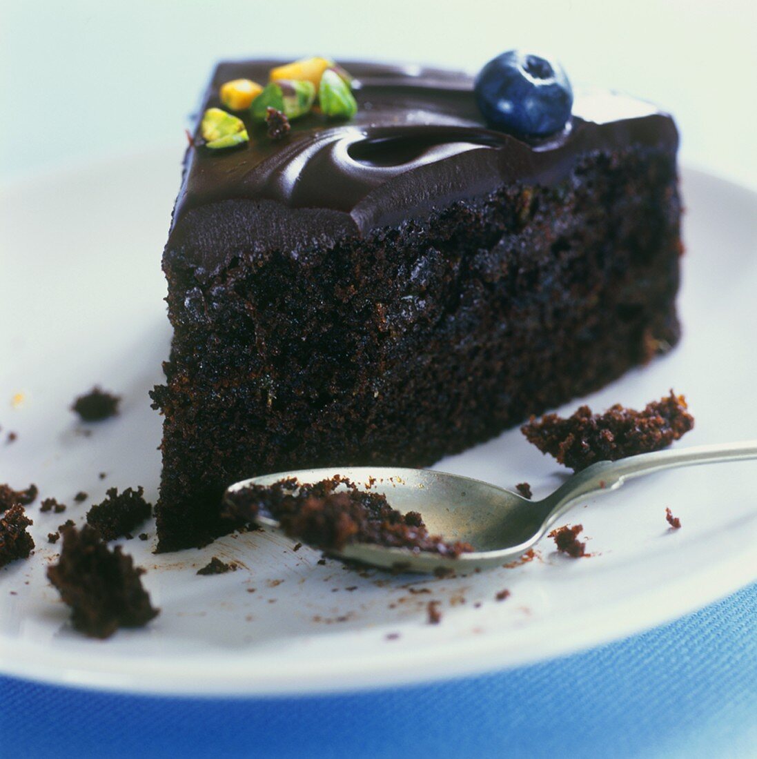 A piece of chocolate cake with chocolate icing