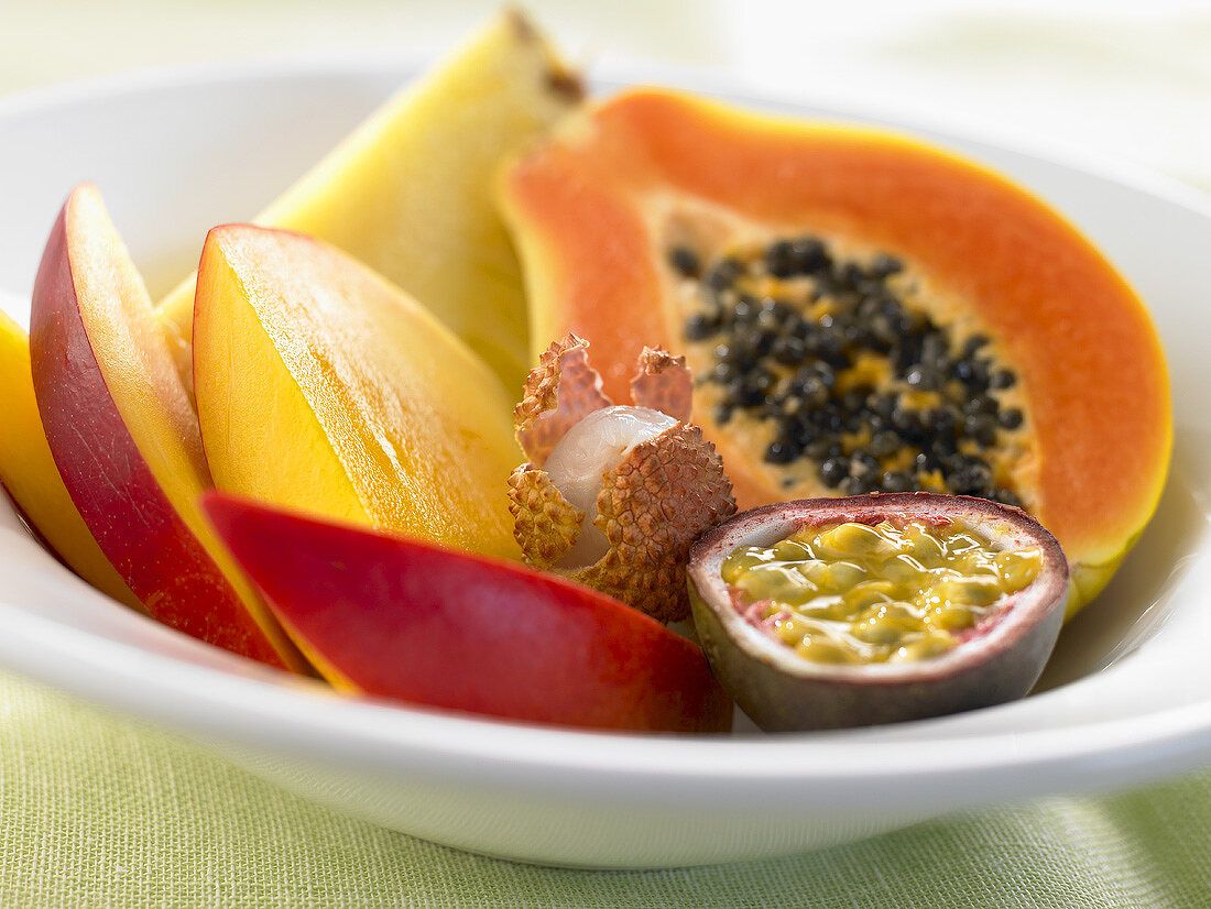Pieces of different exotic fruits on a plate