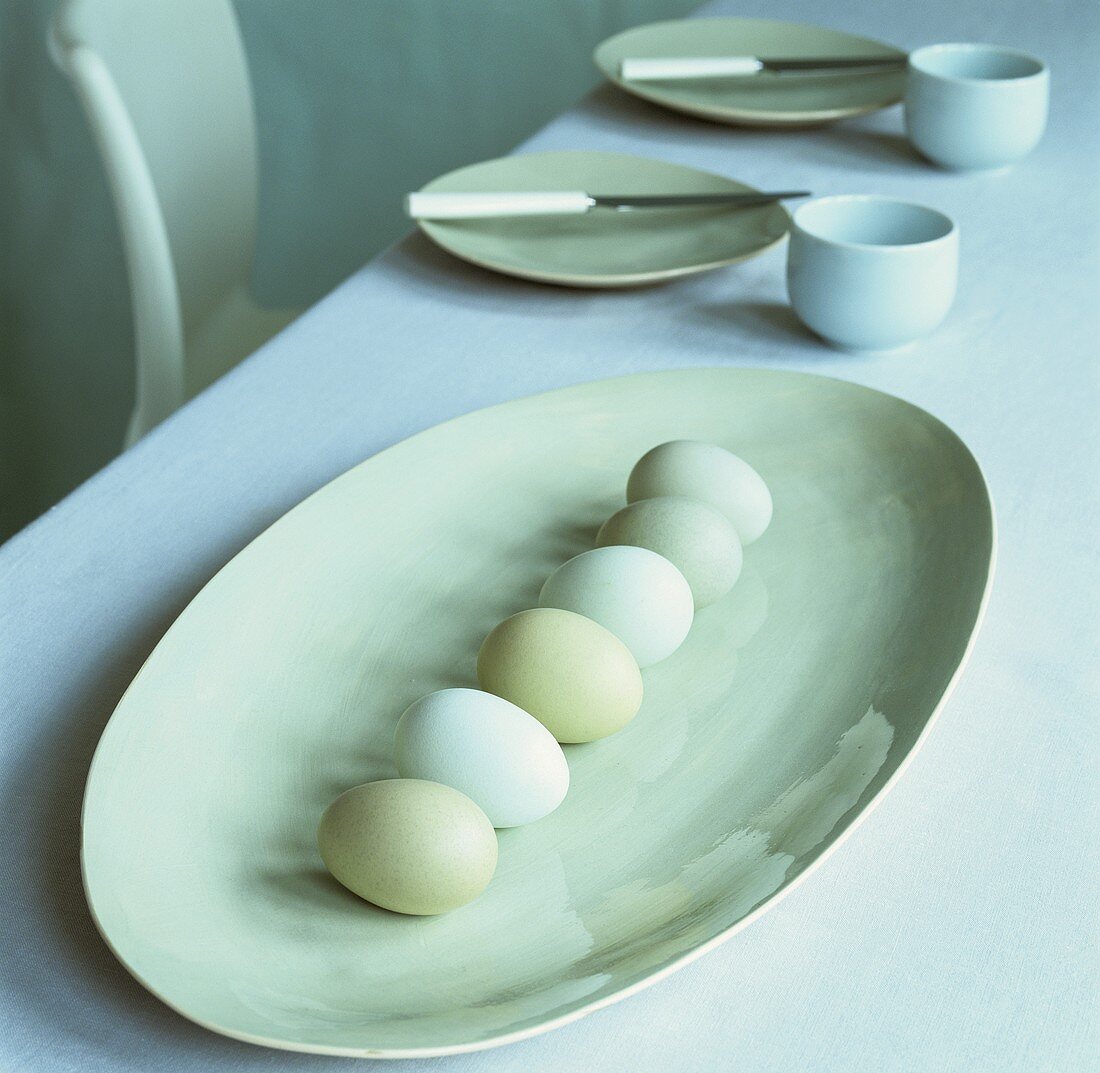 Pale green hens' eggs on a platter