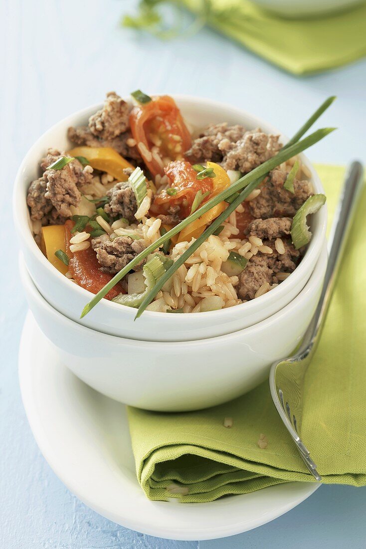Rice and vegetable stir-fry with minced beef in a bowl