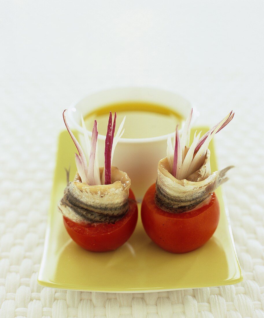 Tomatoes stuffed with matjes herrings and onions, dip