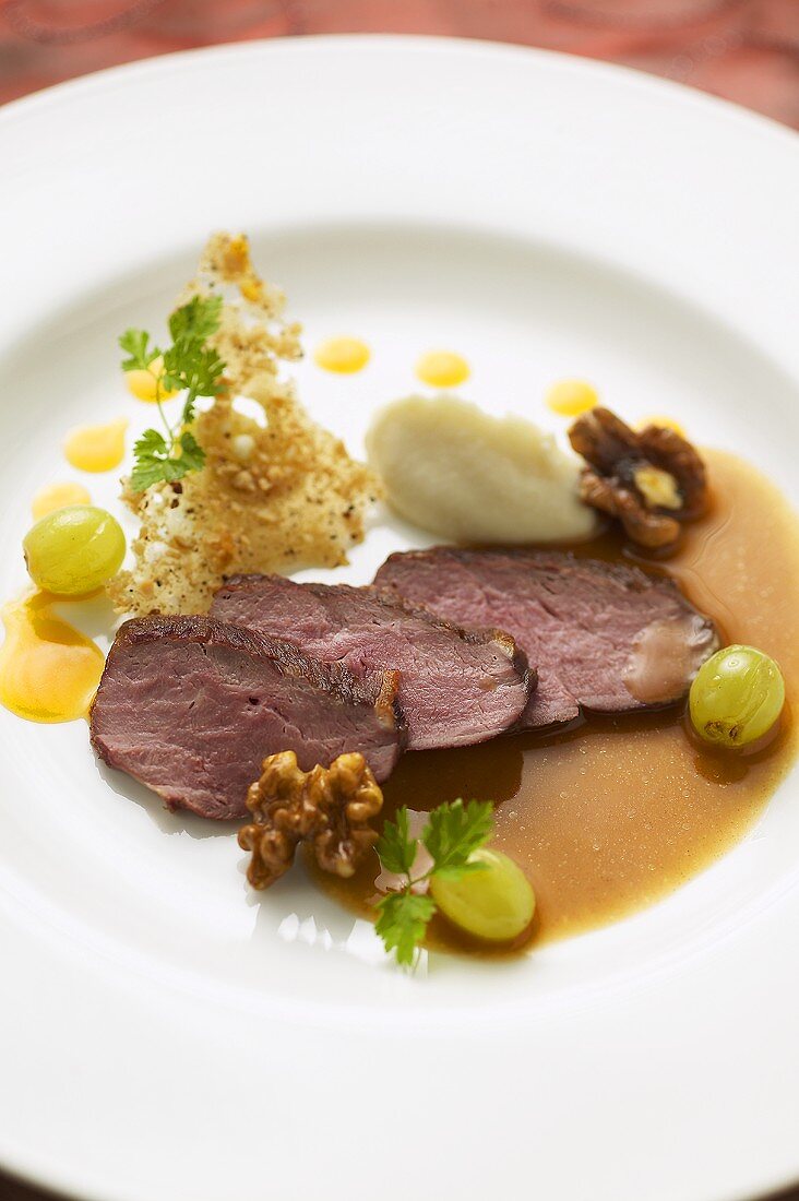 Roast duck breast with grapes, walnuts and parsnip puree