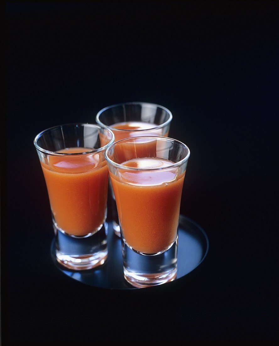 Three shots of gazpacho