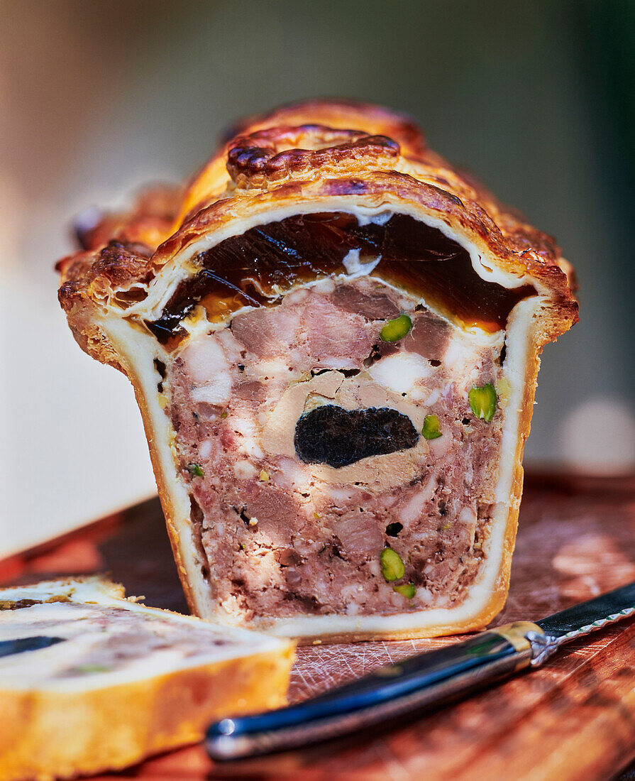 Meat pie with duck liver and truffle in puff pastry