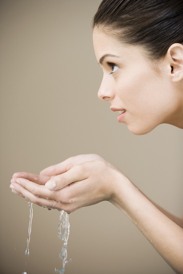 Girl with water in hands