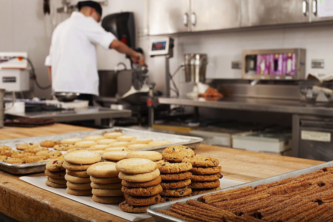 A chef baking cookies in commercial kitchen