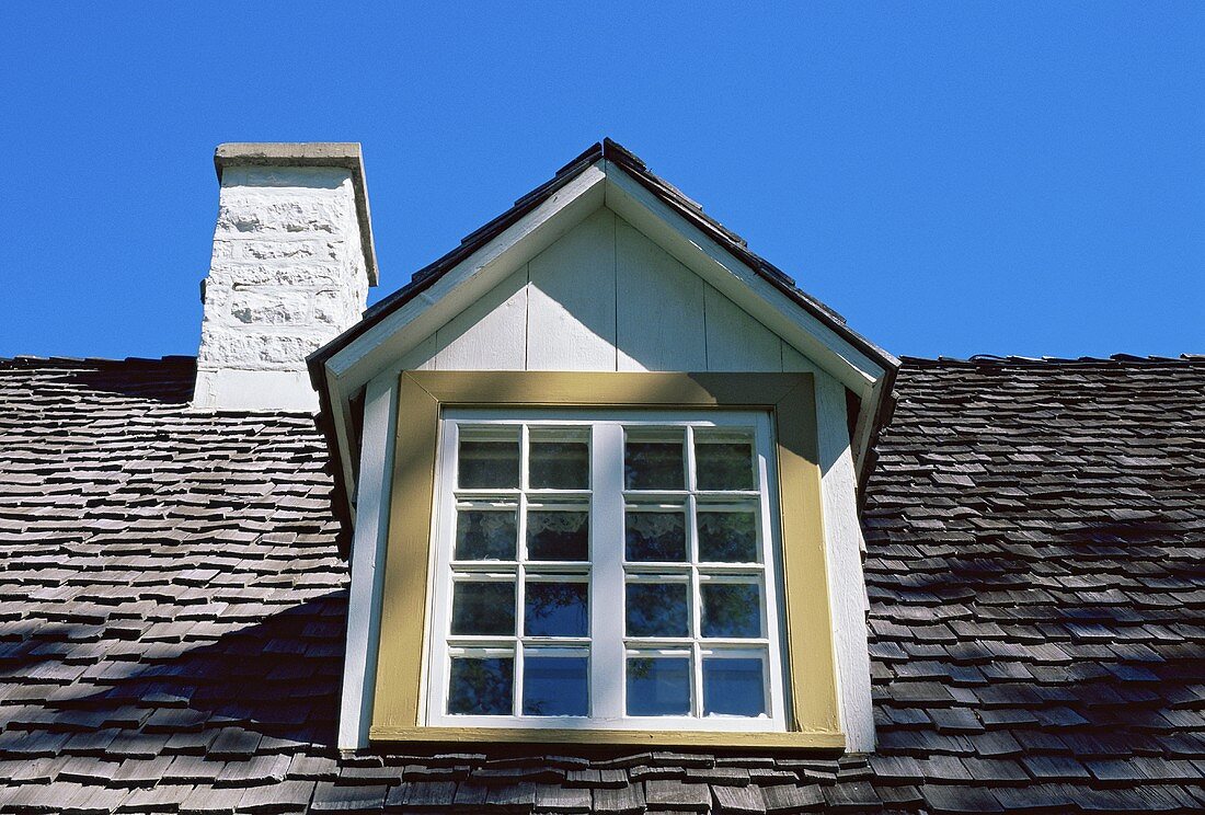 A roof window and a chimney