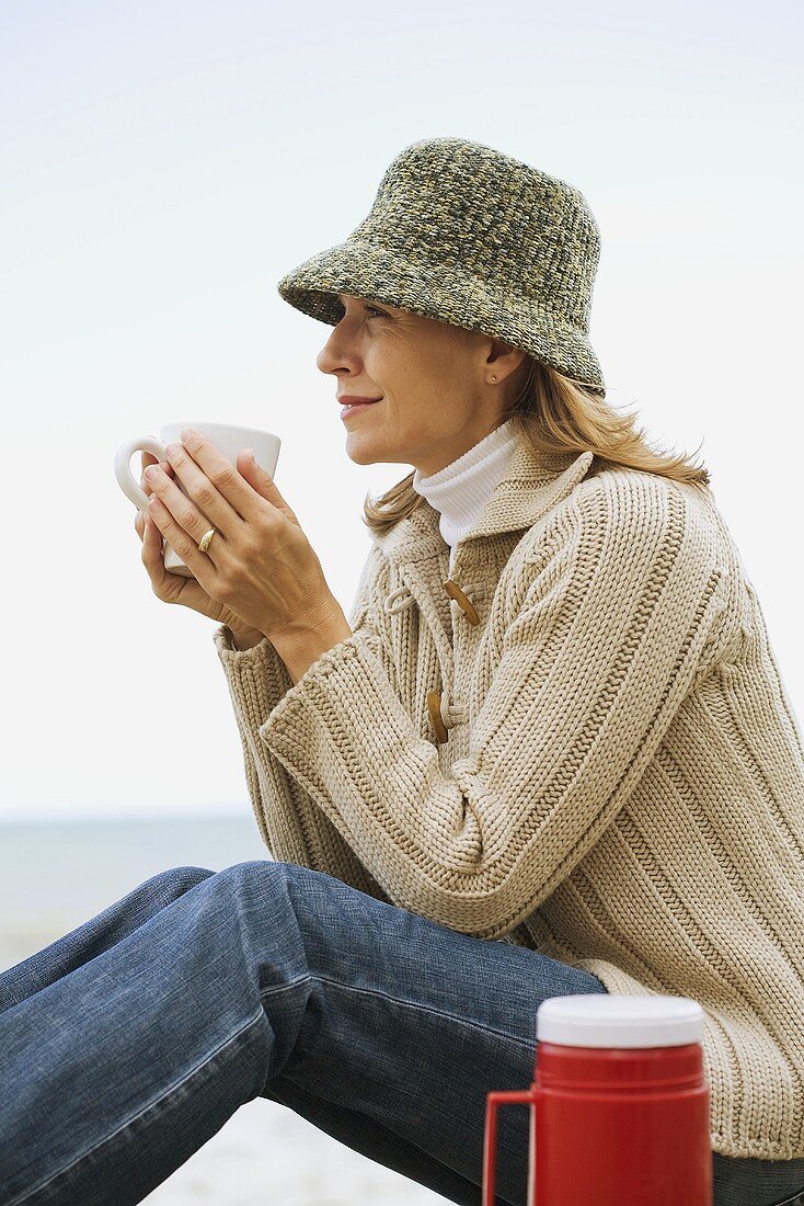 Woman having a hot drink