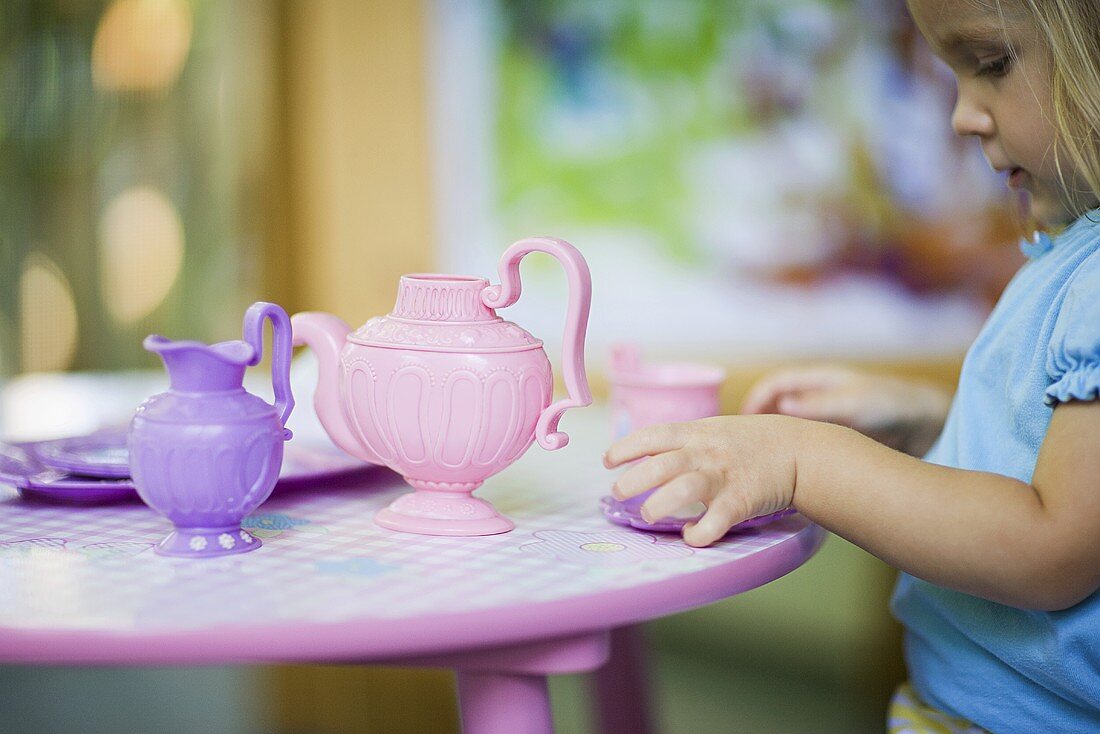 A girl having a tea party