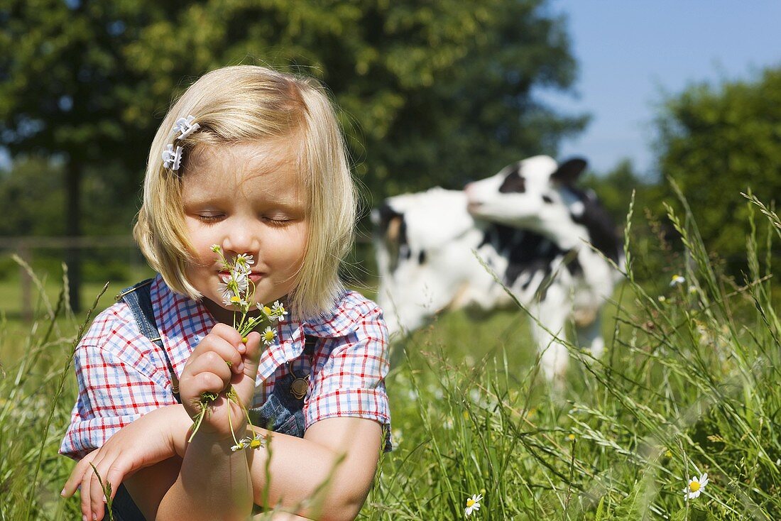 A girl smelling wild flowers