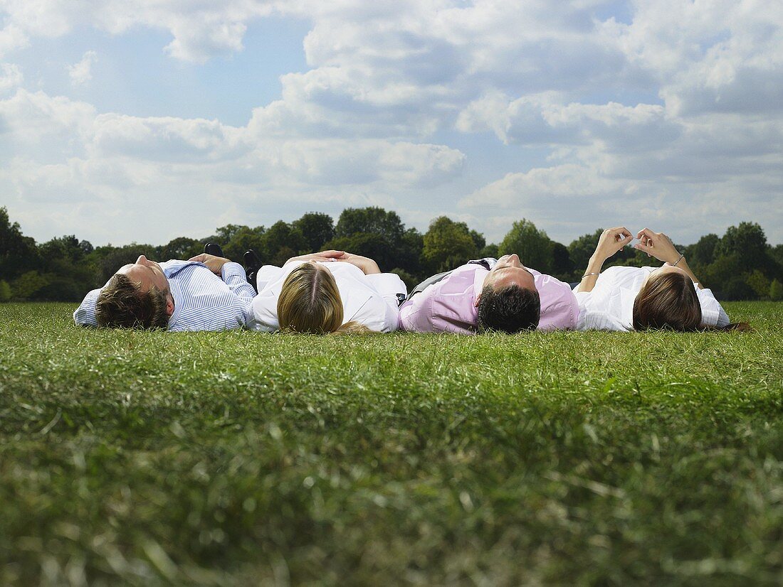 Office workers lying in a row