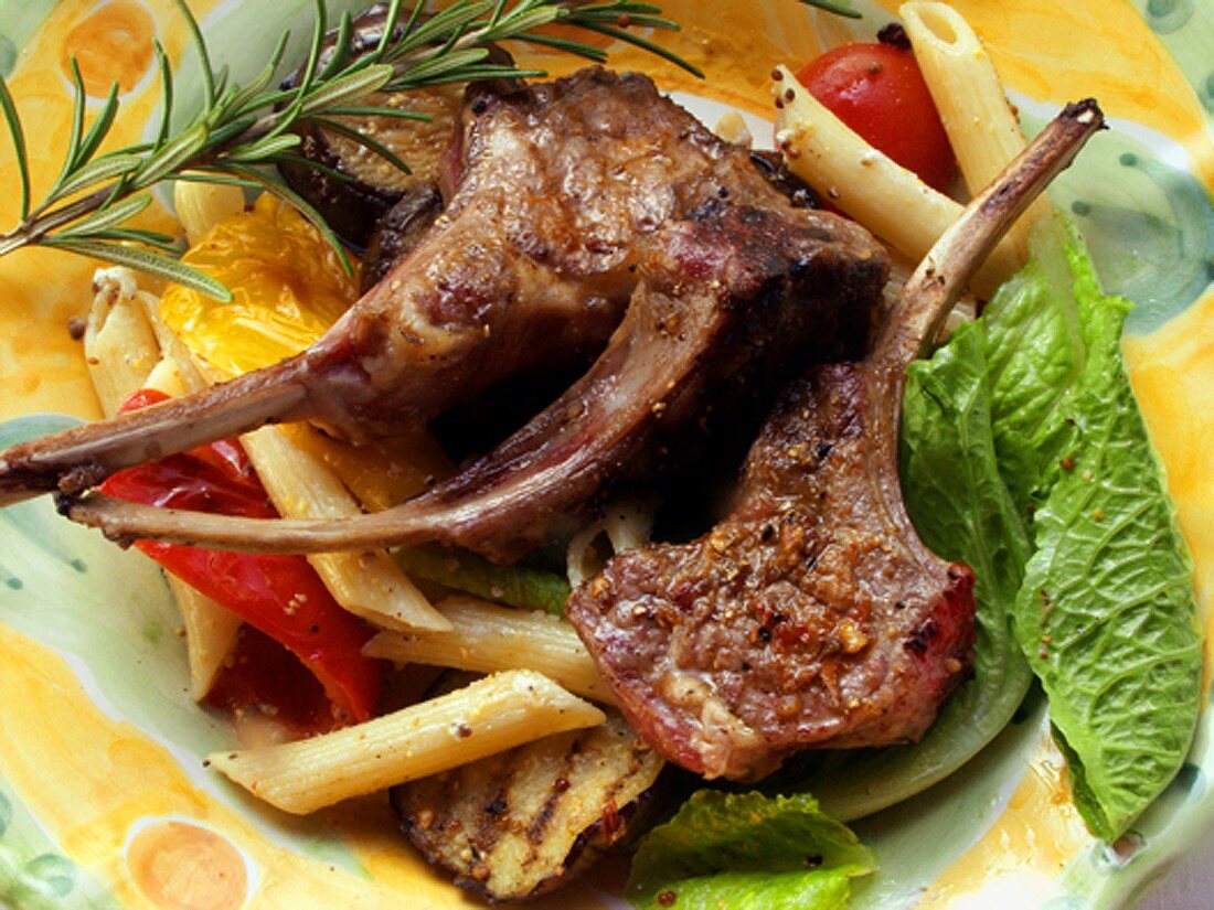 Barbecued lamb chops with pasta and vegetable salad