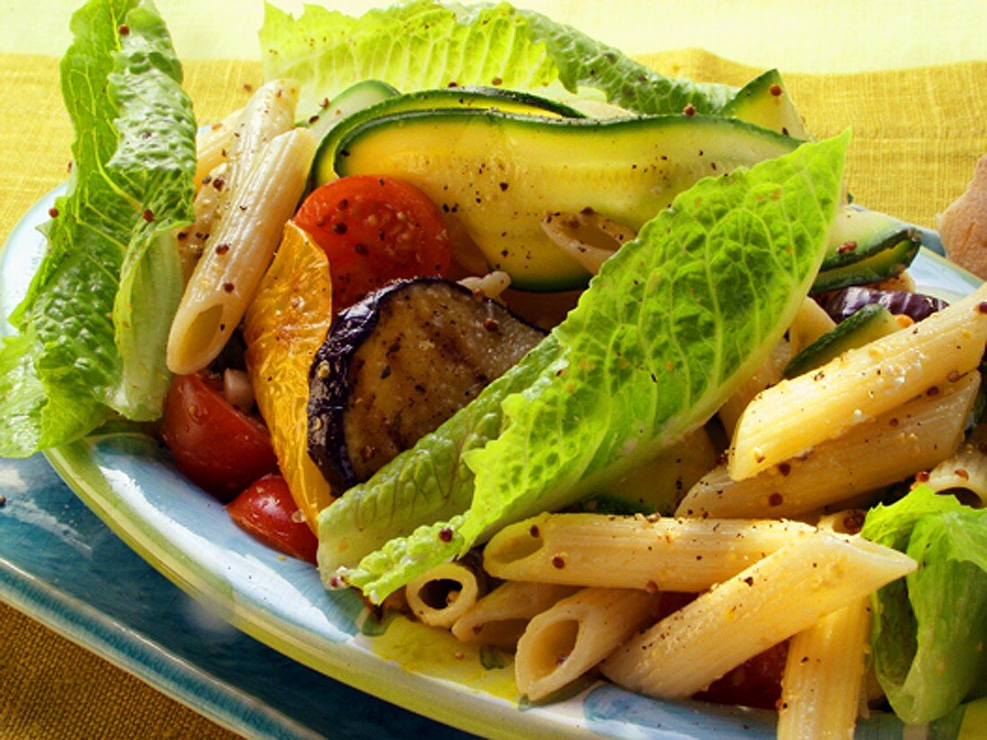 Pasta salad with courgettes, aubergines & romaine lettuce