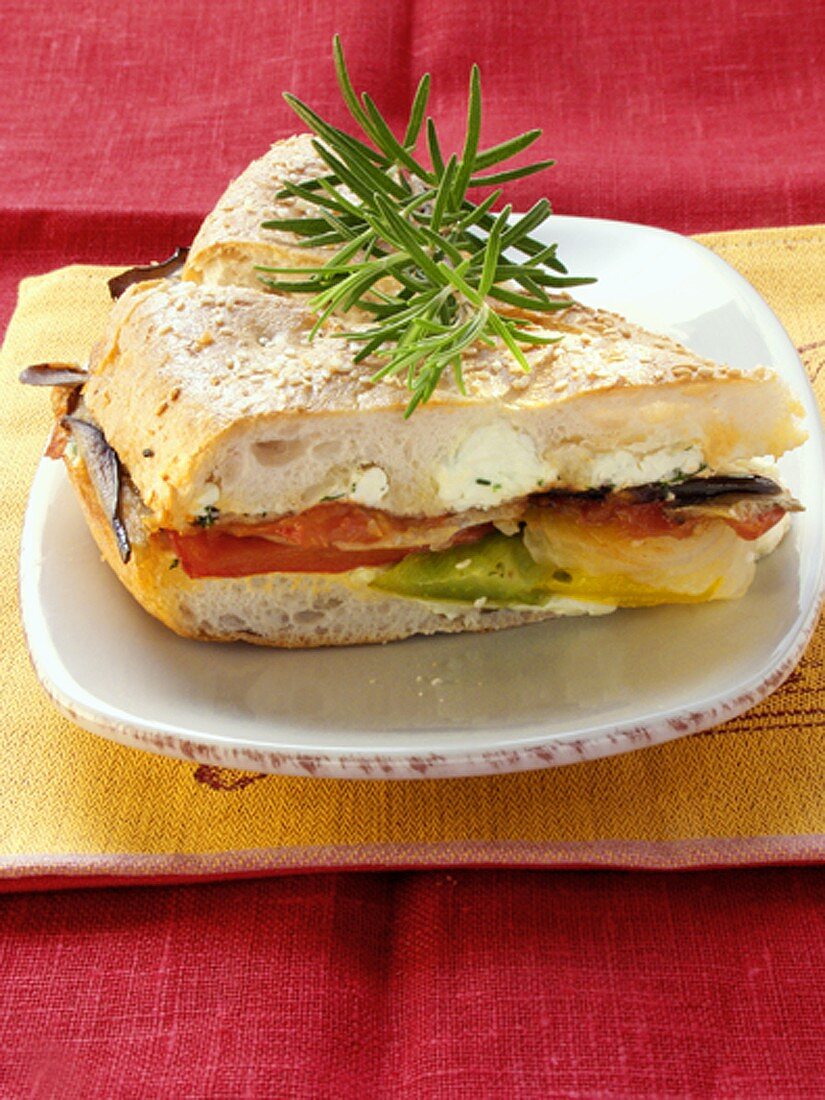 Sandwich with vegetables, cream cheese and rosemary