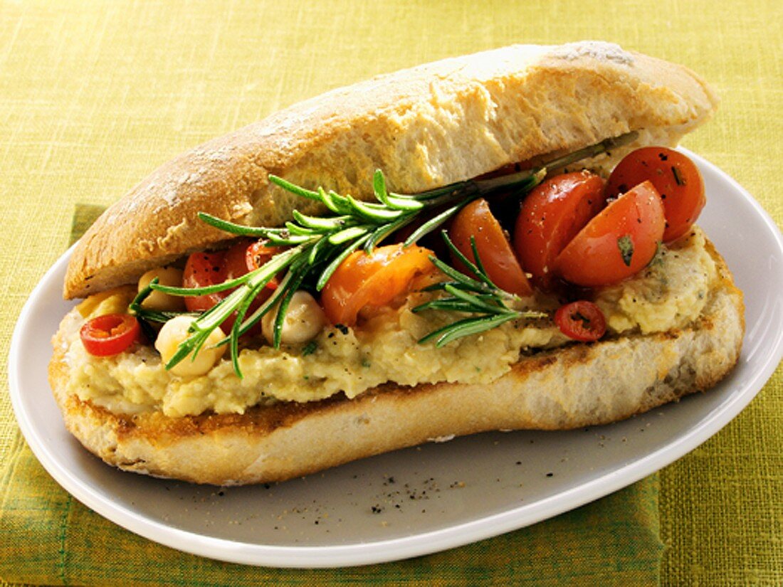 Vegetarian sandwich with hummus and cherry tomatoes