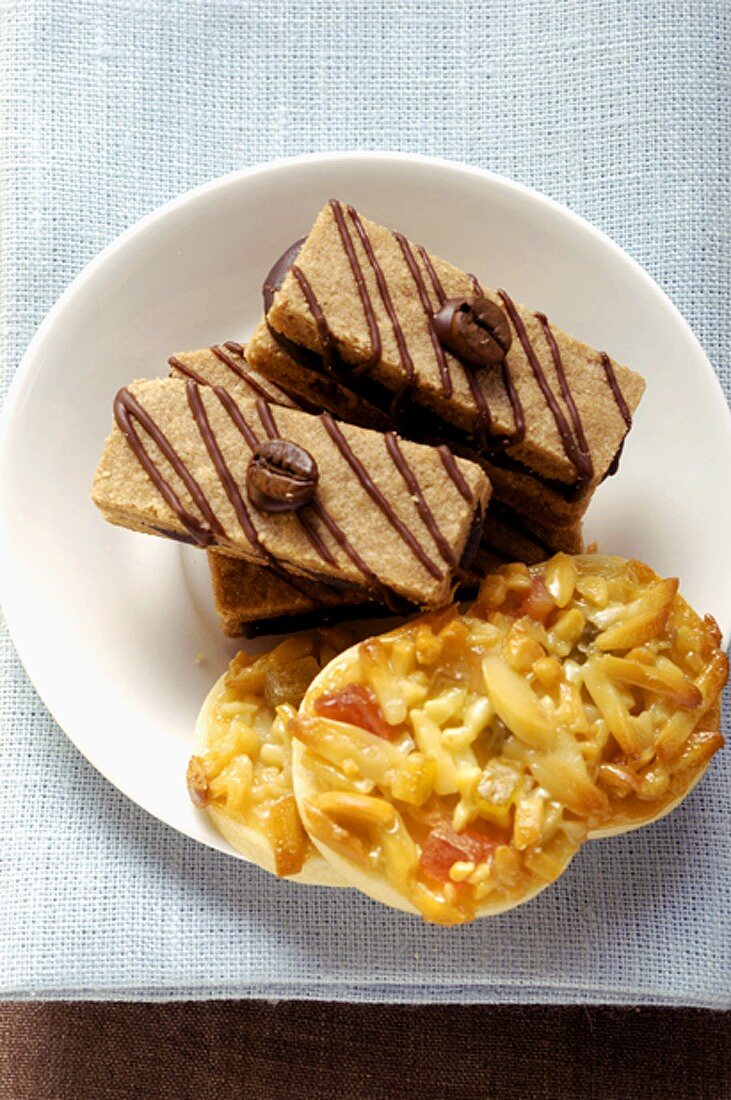 Espresso biscuits and Florentines on plate